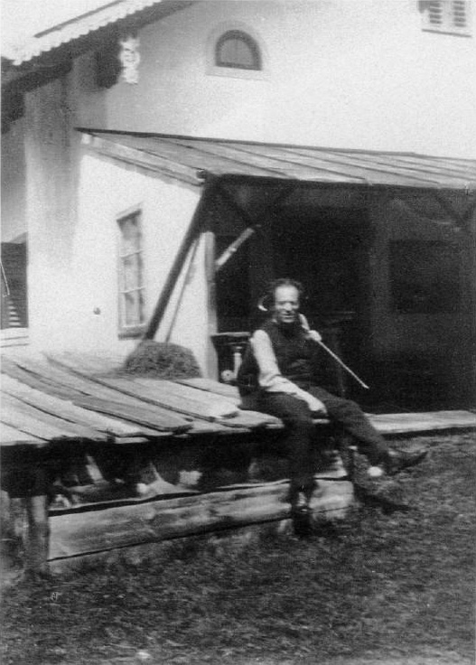 Gustav Mahler taking a break after mowing the lawn.