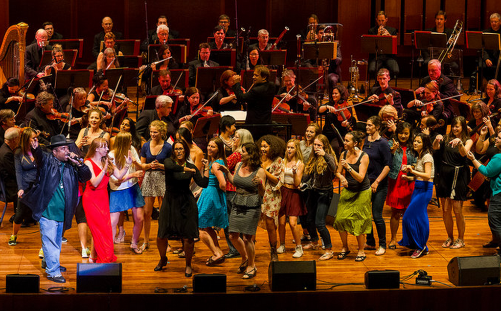 Sir Mix-A-Lot, far left, performing “Baby Got Back” with the Seattle Symphony. Credit: Ben VanHouten