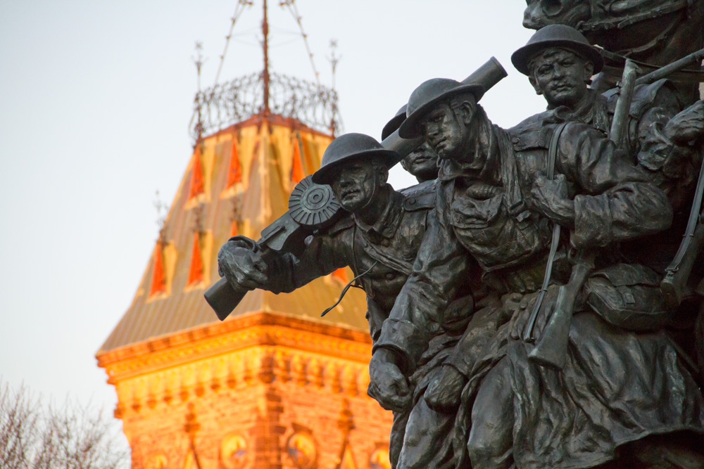 The National War Memorial (also known as The Response), Ottawa, Canada. The Parliament Building's East Block is seen in the background. Photo: Paul Balchin