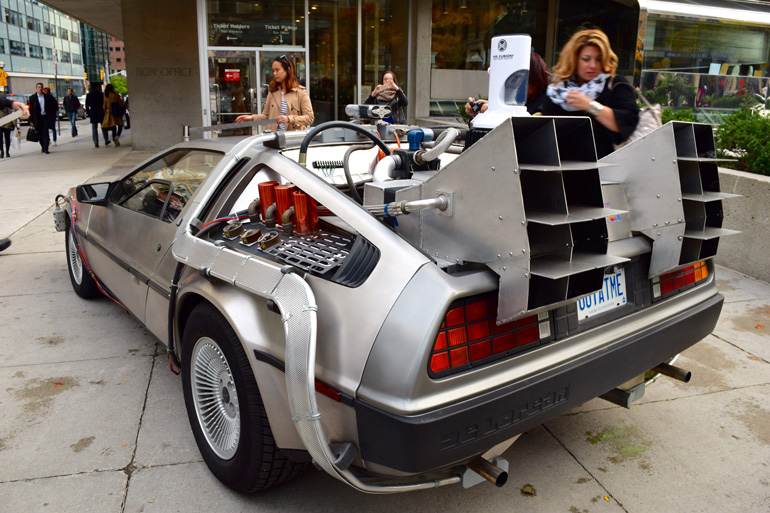 Back to the Future DeLorean with OUTATIME licence plate, parked our front Roy Thomson Hall. (Photo: via TSO) 