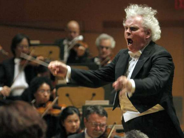 Simon Rattle conducts the Los Angeles Philharmonic at Walt Disney Concert Hall in 2012.