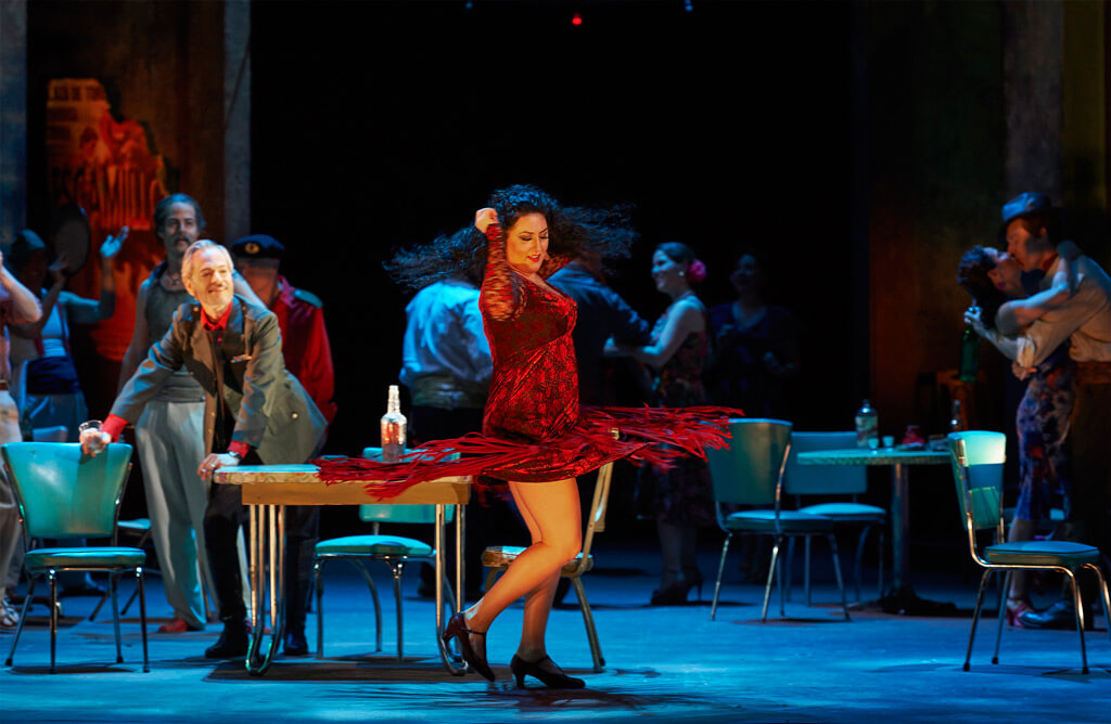 Anita Rachvelishvili as Carmen (centre) as Alain Coulombe as Zuniga looks on (at left) in the Canadian Opera Company production of Carmen, 2016, (Photo: Michael Cooper)