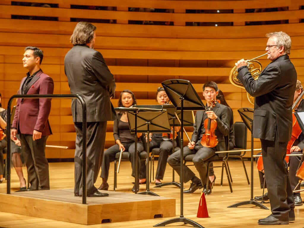 Tenor Nicholas Phan (left), conductor Joseph Swenson (centre), Neil Deland (right) with the TSM Festival Strings. (Photo: James M. Ireland)