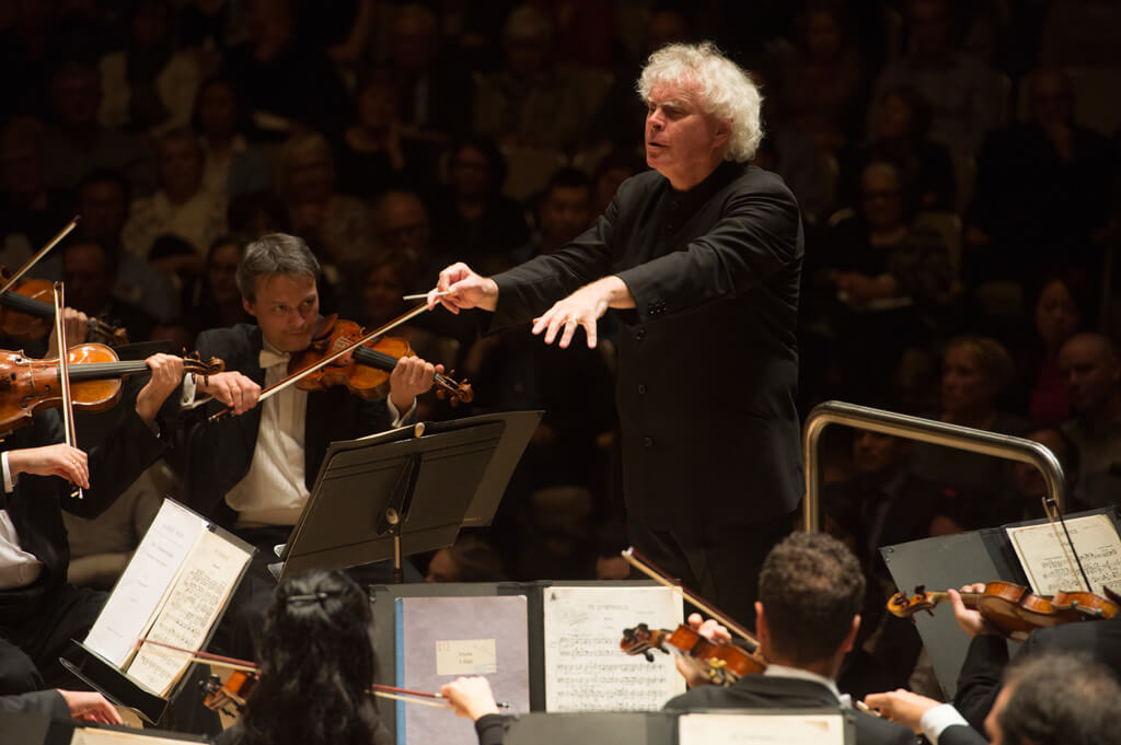 Sir Simon Rattle conducts the Berlin Philharmonic at Roy Thomson Hall. (Photo: Jag Gundu)