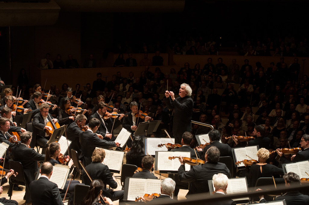 Sir Simon Rattle conducts the Berlin Philharmonic at Roy Thomson Hall. (Photo: Jag Gundu)