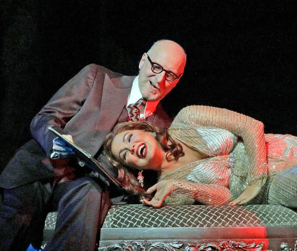 Brindley Sherratt as Geronte di Ravoir and Anna Netrebko in the title role of Puccini's Manon Lescaut. (Photo: Ken Howard)