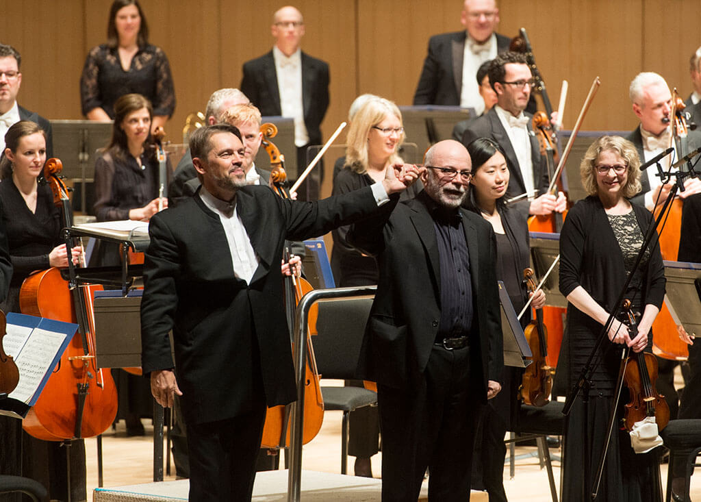 Conductor Andrey Boreyko and composer Christos Hatzis take a bow after his evocation of Shakespeare’s The Tempest (Photo: Jag Gundu)