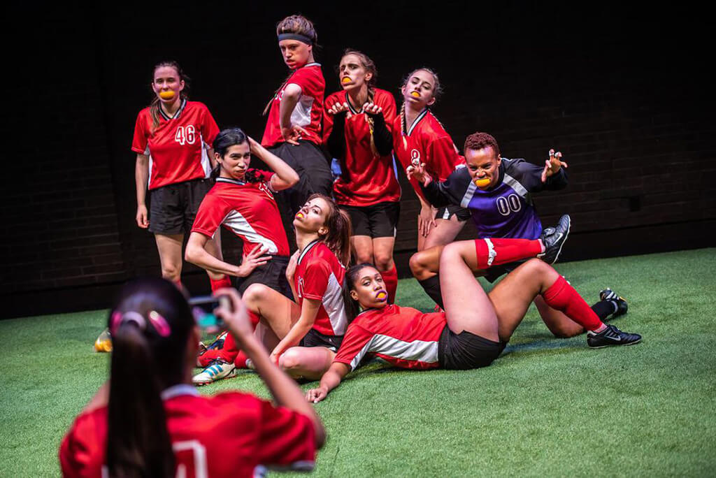 (l-r) Ula Jurecka, Heath V. Salazar, Rachel Cairns, Annelise Hawrylak, Hallie Seline, Amaka Umeh (Front) Ruth Goodwin, Aisha Evelyna in The Wolves. (Photo: Dahlia Katz)