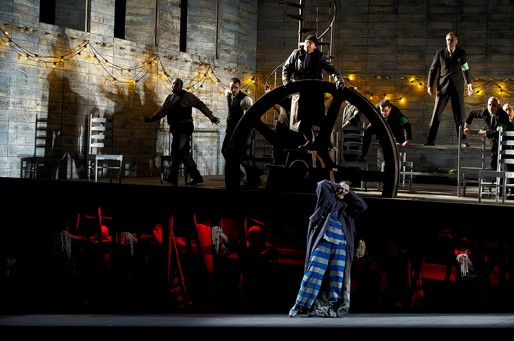 Adam Luther (at wheel) as The Steersman and Evgeny Nikitin as The Dutchman with the COC Chorus in the Canadian Opera Company’s production of The Flying Dutchman, 2010 (Photo: Michael Cooper)