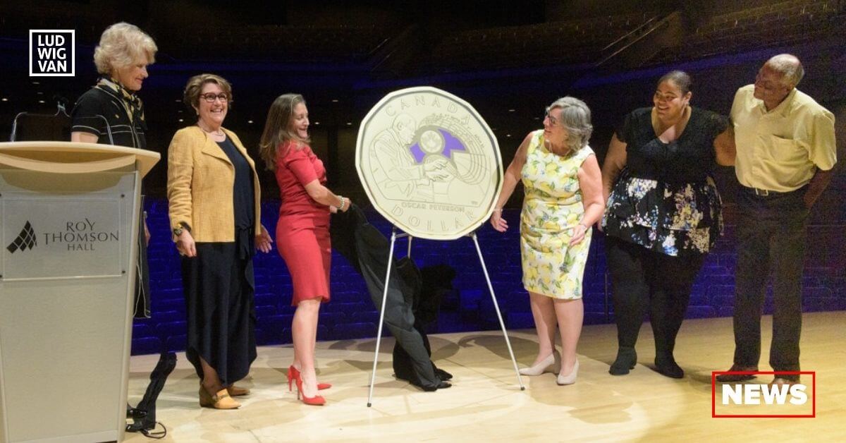 L-R: Phyllis Clark, Chair of the Royal Canadian Mint (RCM) Board of Directors, Marie Lemay, RCM President and CEO, The Honourable Chrystia Freeland, Deputy Prime Minister and Minister of Finance, Kelly Peterson, Céline Peterson and Norman Peterson unveil a commemorative $1 circulation coin honoring Oscar Peterson at Roy Thomson Hall in Toronto, ON (August 11, 2022). (Photo courtesy of the RCM)
