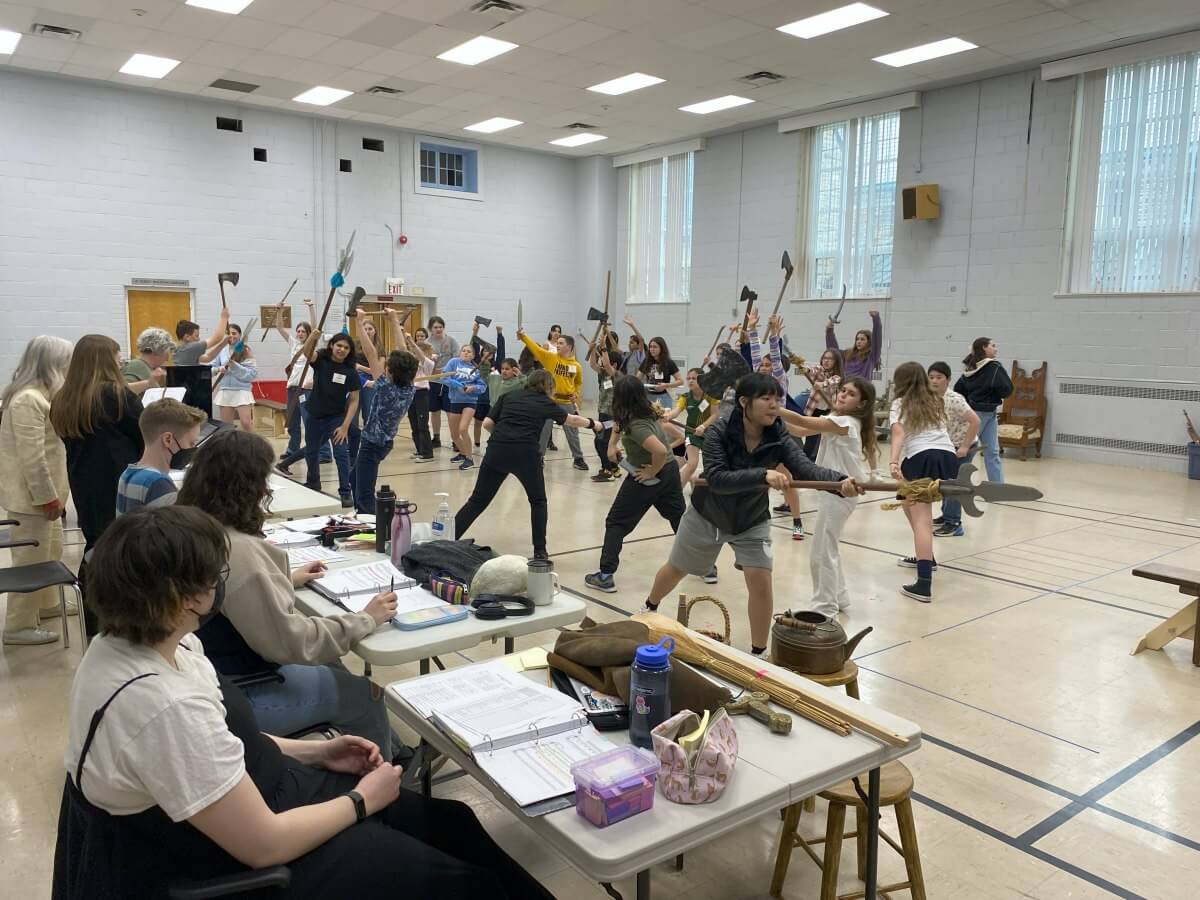 Current CCOC Principal and Youth Chorus members rehearse the great fight sequence in The Hobbit in 2024 (Courtesy of the CCOC)