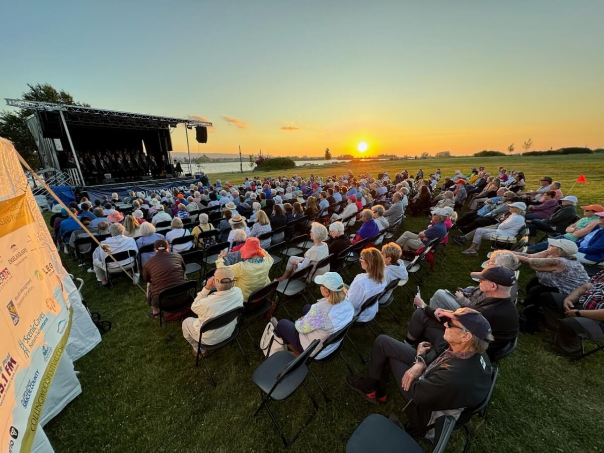 A sunset lit up the Millennium Park stage as the Toronto Welsh Male Voice Choir performed at the Collingwood Music Festival 2024 (Photo: Tjalling Photography)