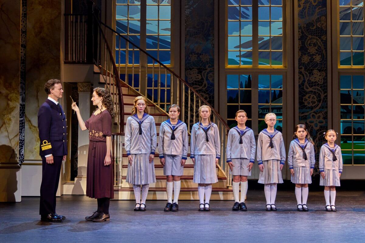 Kevin Earley (Captain Georg von Trapp) and Cayleigh Capaldi (Maria Rainer) with the von Trapp Children (l to r) Ariana Ferch (Liesl), Eli Vander Griend (Friedrich), Ava Davis (Louisa), Benjamin Stasiek (Kurt), Haddie Mac (Brigitta), Ruby Caramore (Marta), Luciana VanDette (Gretl) in The Sound of Music (Photo: Jeremy Daniel)