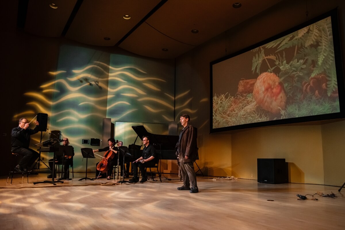 The live performance of Madog, with composer-conductor Paul Frehner, Ensemble Paramirabo, and baritone Jeremy Huw Williams (Photo courtesy of the artists)