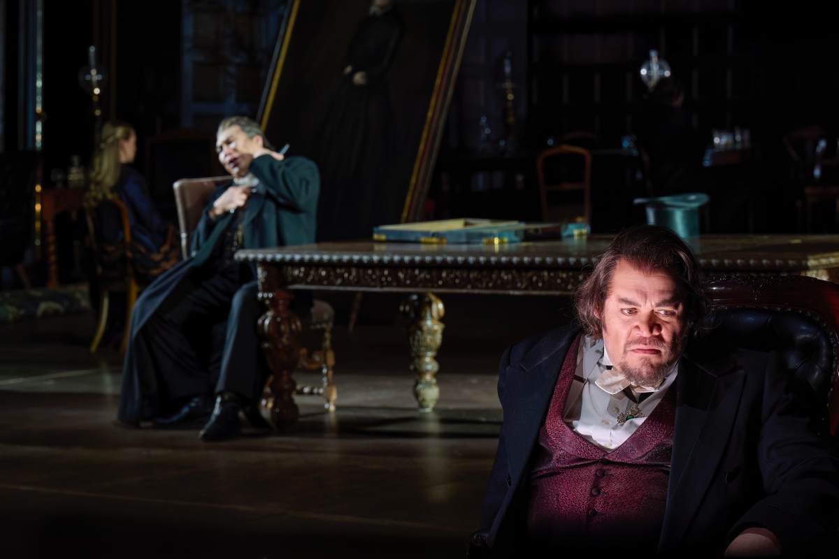 (l-r) Peixin Chen as Sparafucile and Quinn Kelsey as Rigoletto in the Canadian Opera Company’s production of Rigoletto, 2026 (Photo: Michael Cooper)