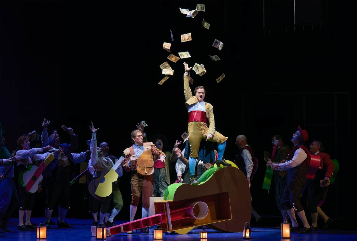 Dave Monaco (centre) as Count Almaviva and Nathan Keoughan (left) as the Officer in the Canadian Opera Company’s production of The Barber of Seville, 2026 (Photo: © Michael Cooper)
