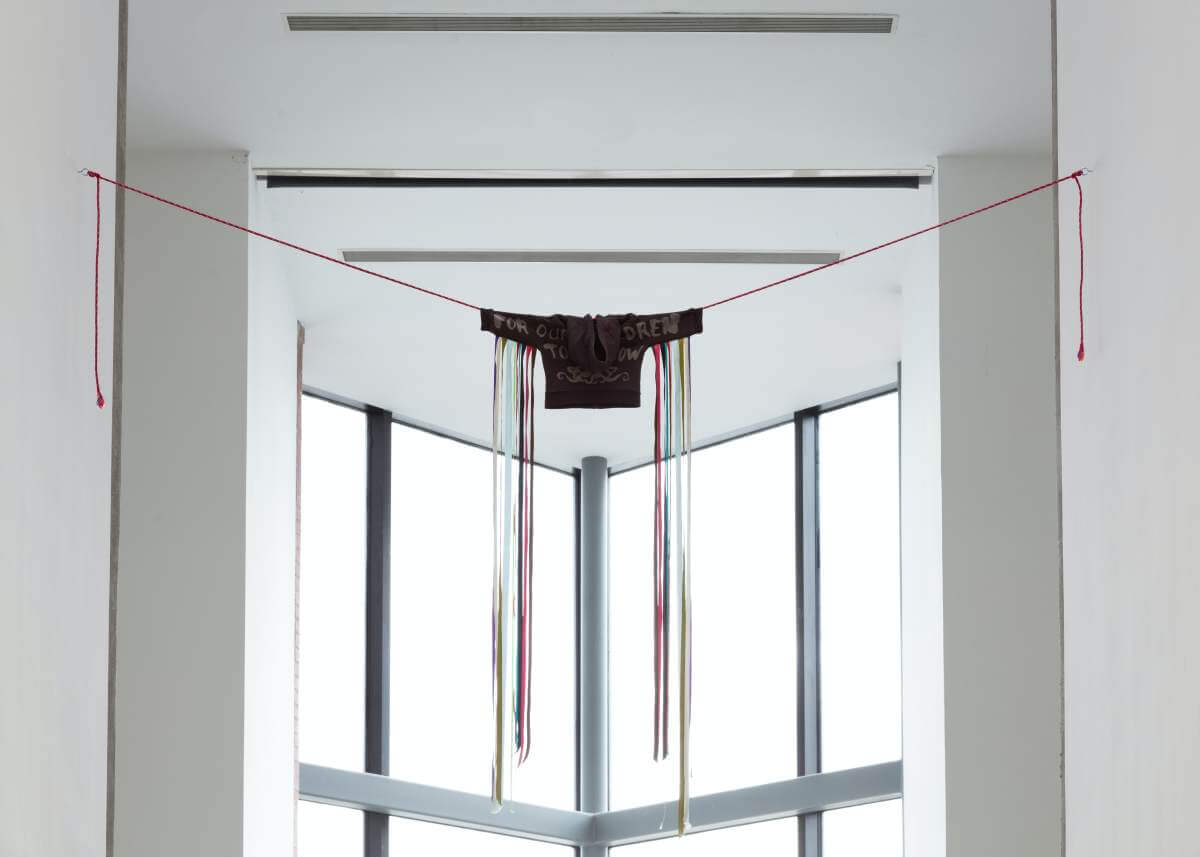 Jeneen Frei Njootli, 1973, 2025. Cotton, bleach, ribbon, rope. Courtesy the artist andMacaulay + Co. Fine Art. Installation view: The skies closed themselves when we averted our gaze, The Power Plant, Toronto, 2025. (Photo: LF Documentation)