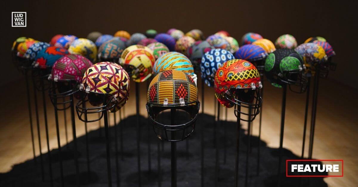 Glorious Bones (2019) by Esmaa Mohamoud. Repurposed football helmets, wax print fabrics, steel, and recycled tires (Photo courtesy of Esmaa Mohamoud Studio)