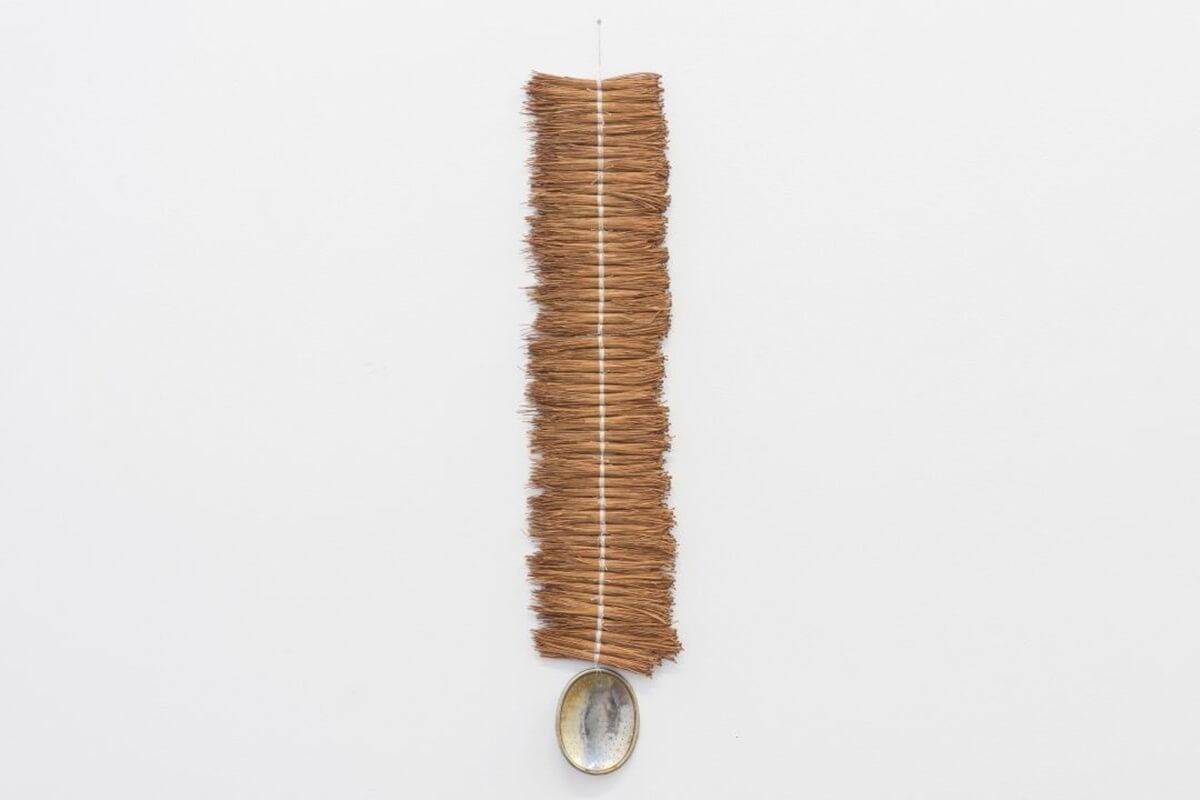 Leeay Aikawa, Bindu, 2024. Pine needles, found object, cotton thread. Image courtesy of the artist.