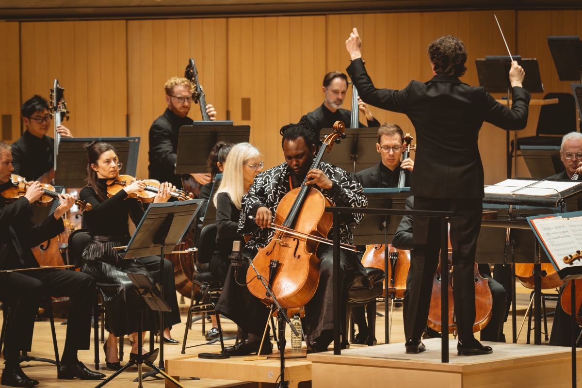 Cellist Abel Selaocoe performs with the Toronto Symphony Orchestra and conductor Gustavo Gimeno at Roy Thomson Hall (Photo: Allan Cabral/Courtesy of the Toronto Symphony Orchestra)