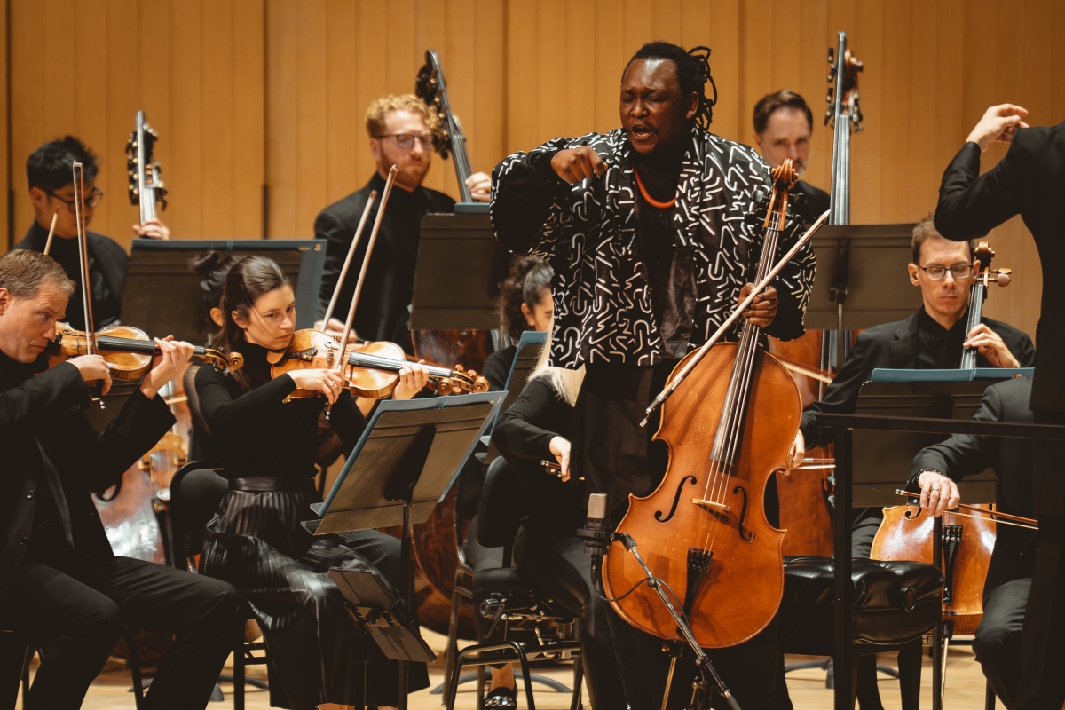 Cellist Abel Selaocoe performs with the Toronto Symphony Orchestra and conductor Gustavo Gimeno at Roy Thomson Hall (Photo: Allan Cabral/Courtesy of the Toronto Symphony Orchestra)