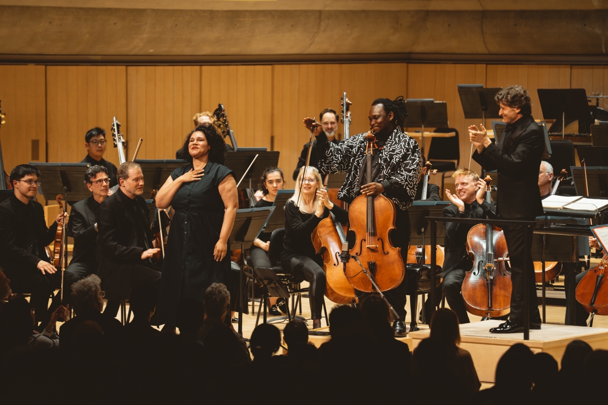Cellist Abel Selaocoe and composer Jessie Montgomery with the Toronto Symphony Orchestra and conductor Gustavo Gimeno at Roy Thomson Hall (Photo: Allan Cabral/Courtesy of the Toronto Symphony Orchestra)