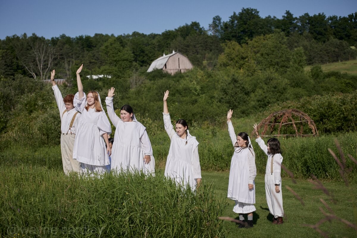 The Ghost Chorus in 4th Line Theatre’s production of Schoolhouse by Leanna Brodie, directed and choreographed by Monica Dottor, costumes by Chelsea Day, set design by Michelle Chesser (Photo: Wayne Eardley, Brookside Studio)